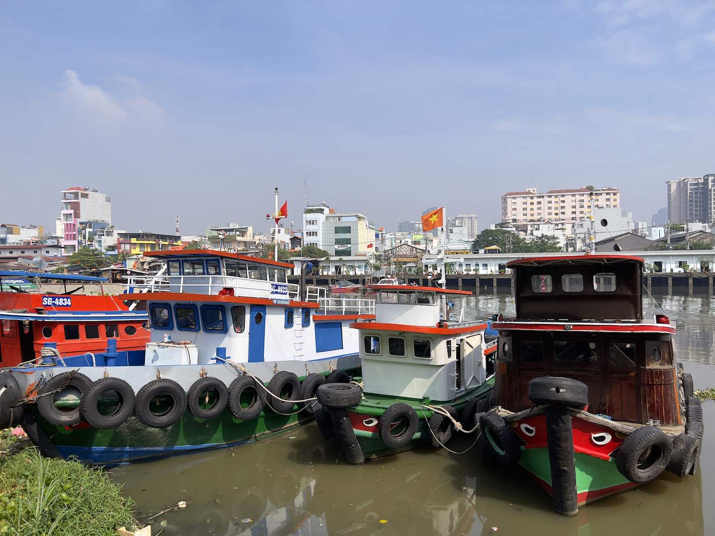Vietnamese boats anchoring by the river