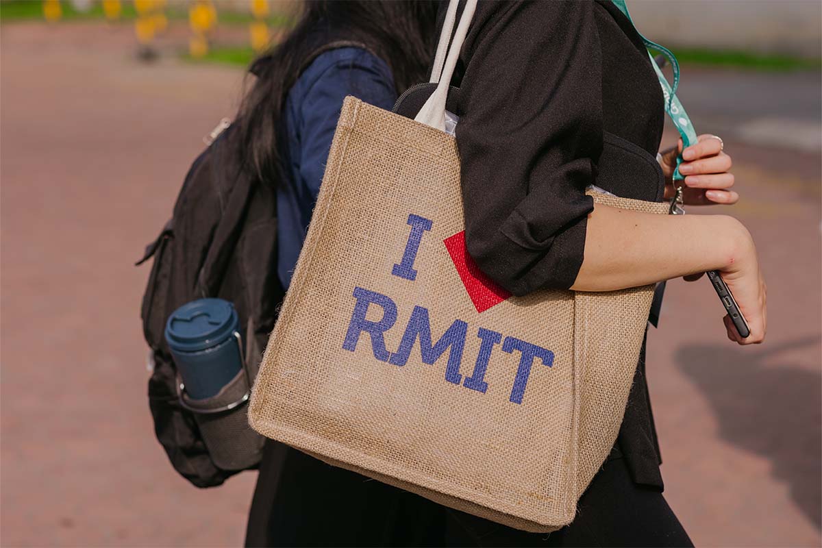 a person carrying rmit totebag