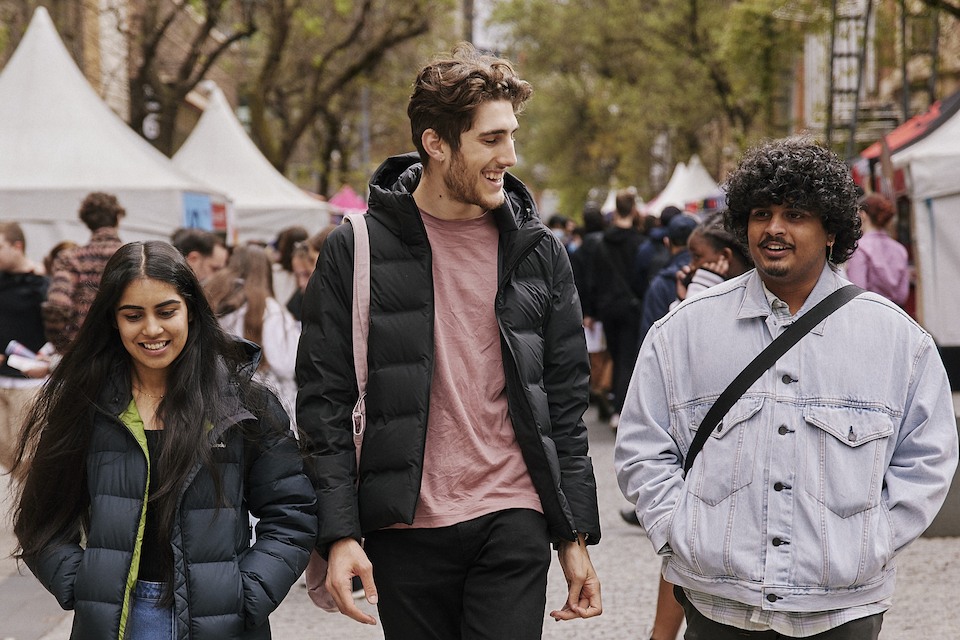 Three students are walking