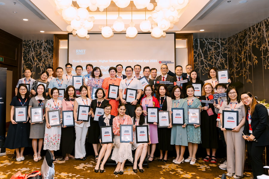 Participants pose with their certificates