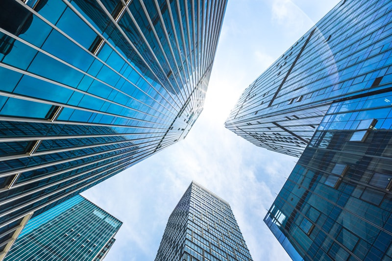 View from the ground towards two skyscrapers