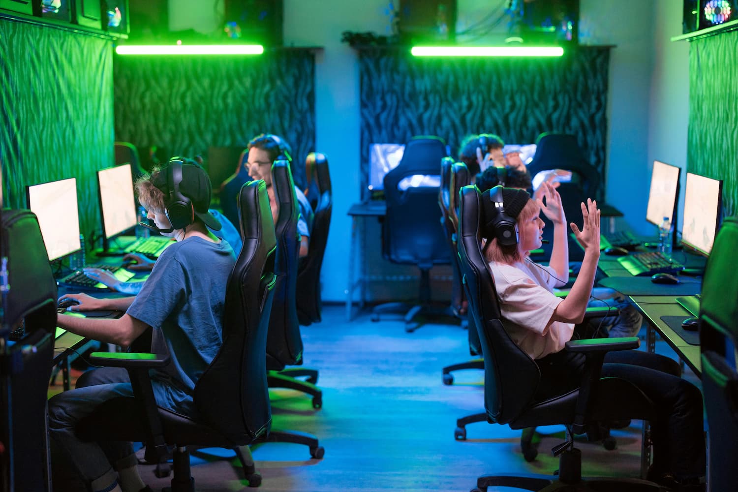 Teenagers sitting at computers