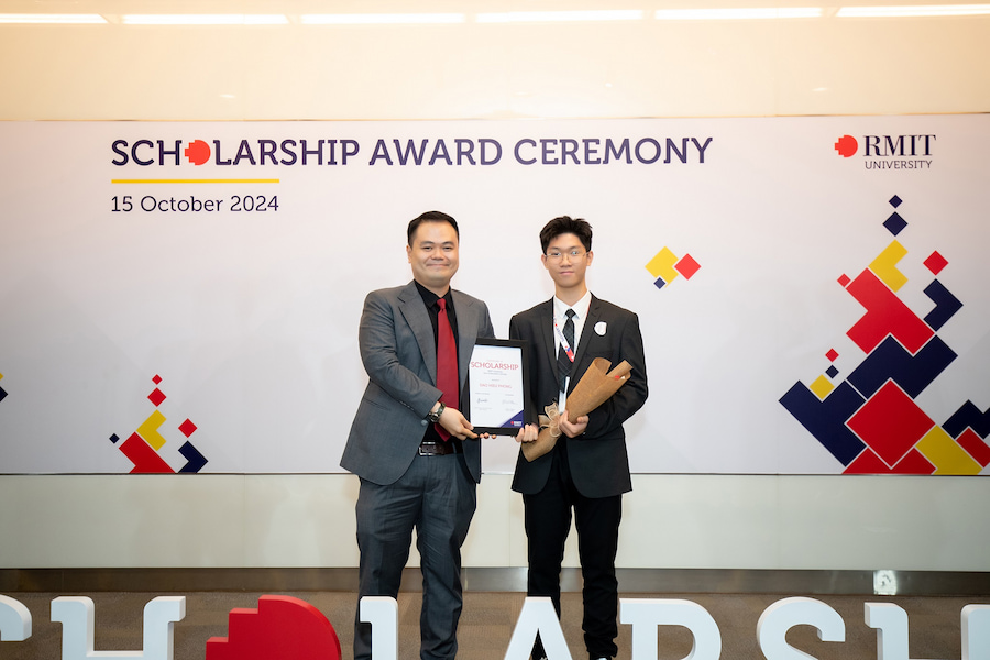 Phong (pictured right) received the RMIT scholarship on 15 October 2024. (Photo: RMIT)