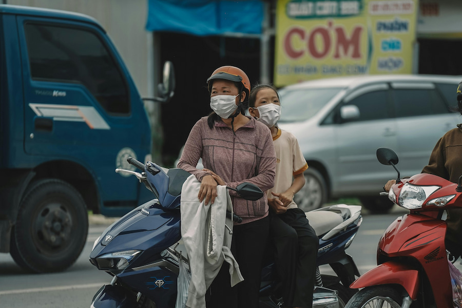 Woman and young girl wearing face masks