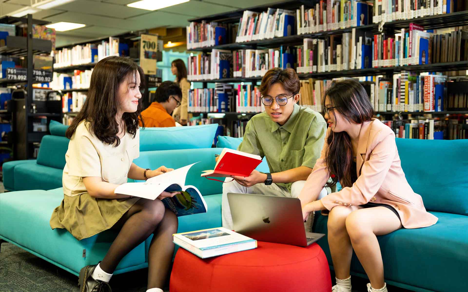 a group of students working in a library