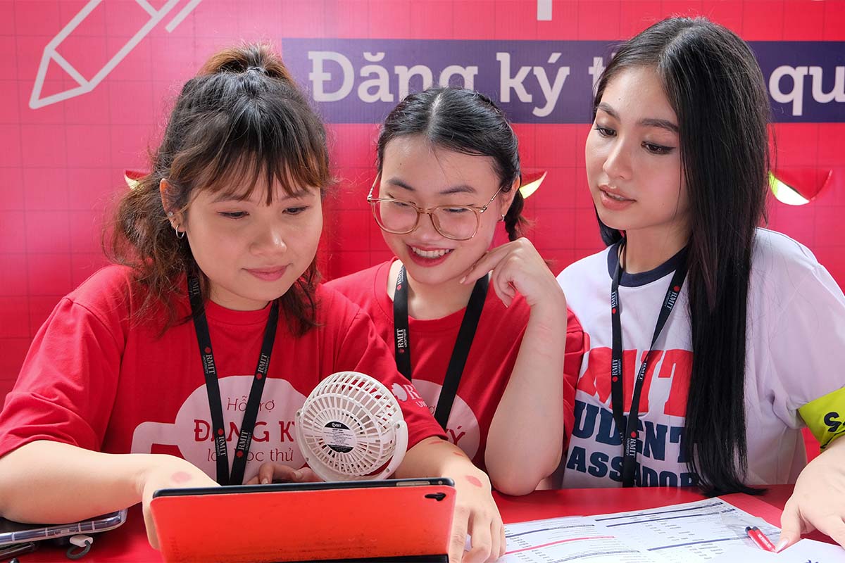 students-checking-tablet-screen.jpg